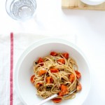 Spaghetti with baked tomato, pesto with olives and capers